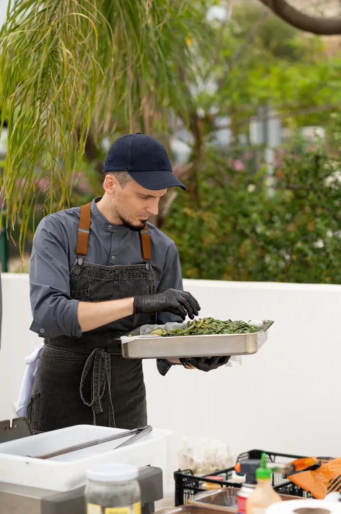 Chef finishing a catering tray